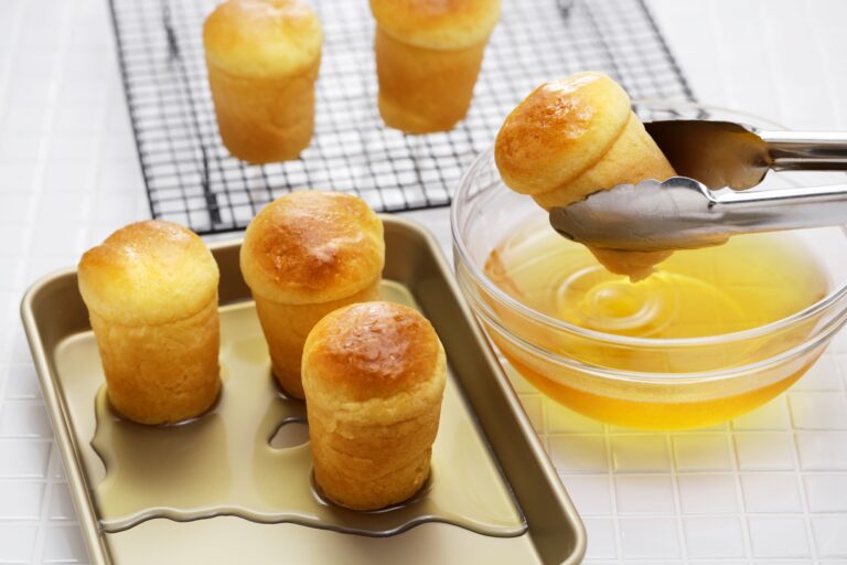making rum baba ( baba au rhum ), traditional French and Italian dessert