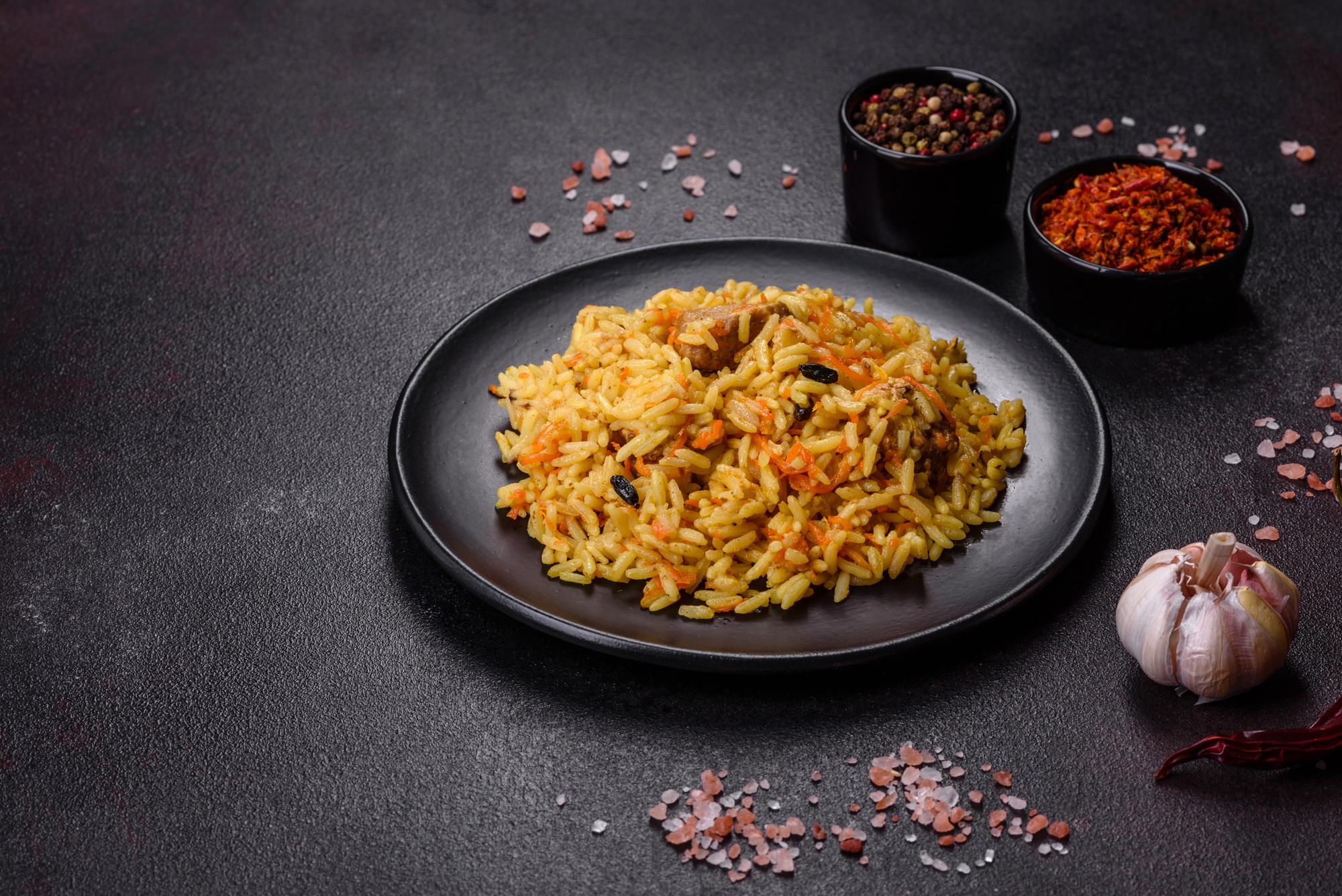Pilaf with chicken, hot dish of boiled rice, chicken meat and spices