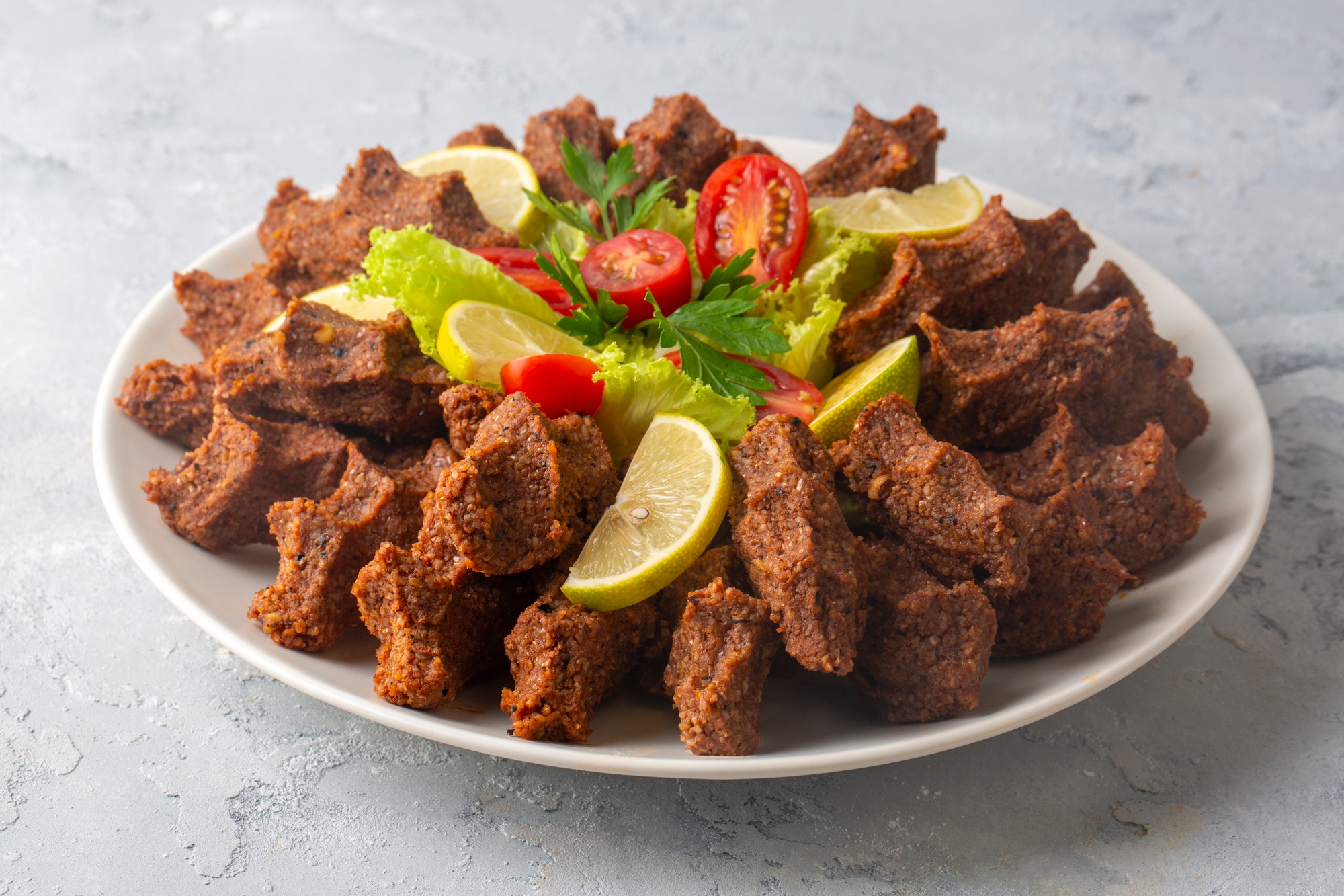 Traditional delicious Turkish food; Turkish name; Cig kofte (raw meatball in Turkish) with lettuce