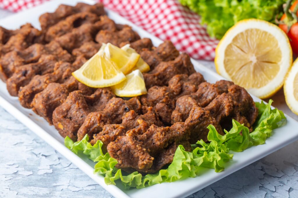 Traditional delicious Turkish food; Turkish name; Cig kofte (raw meatball in Turkish) with lettuce